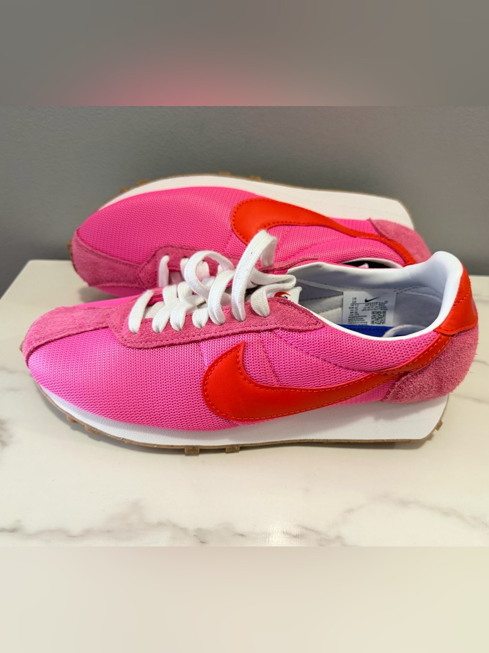 Nike women’s Pink and Red Retro Runner Sneakers